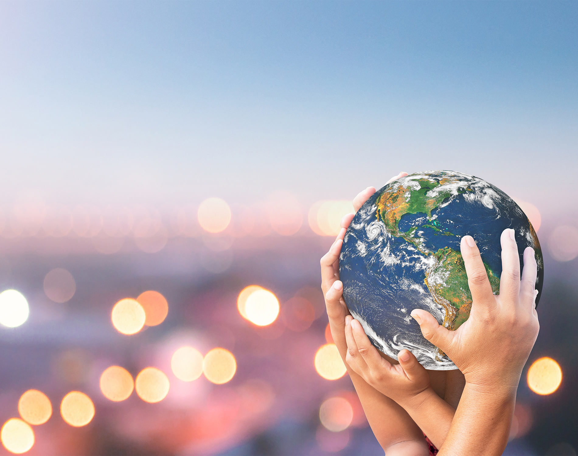 Hands holding a globe